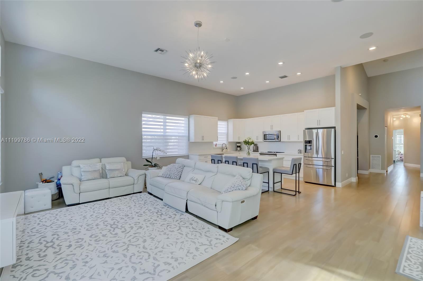 9901 North Abiaca Circle Davie, FL 33328 - Photo 17 of 46 a living room with furniture and white walls
