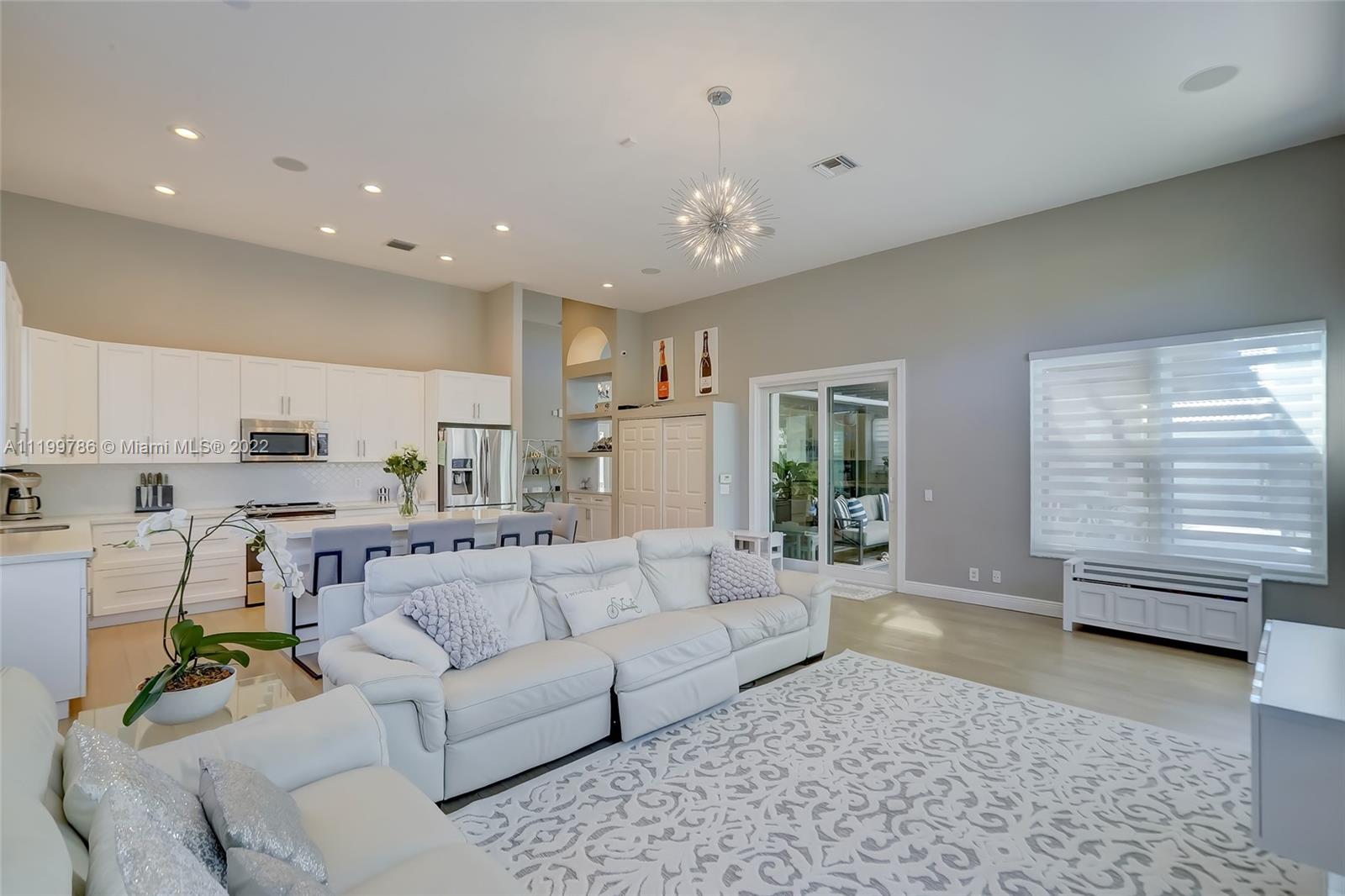 9901 North Abiaca Circle Davie, FL 33328 - Photo 18 of 46 a living room with furniture and a large window