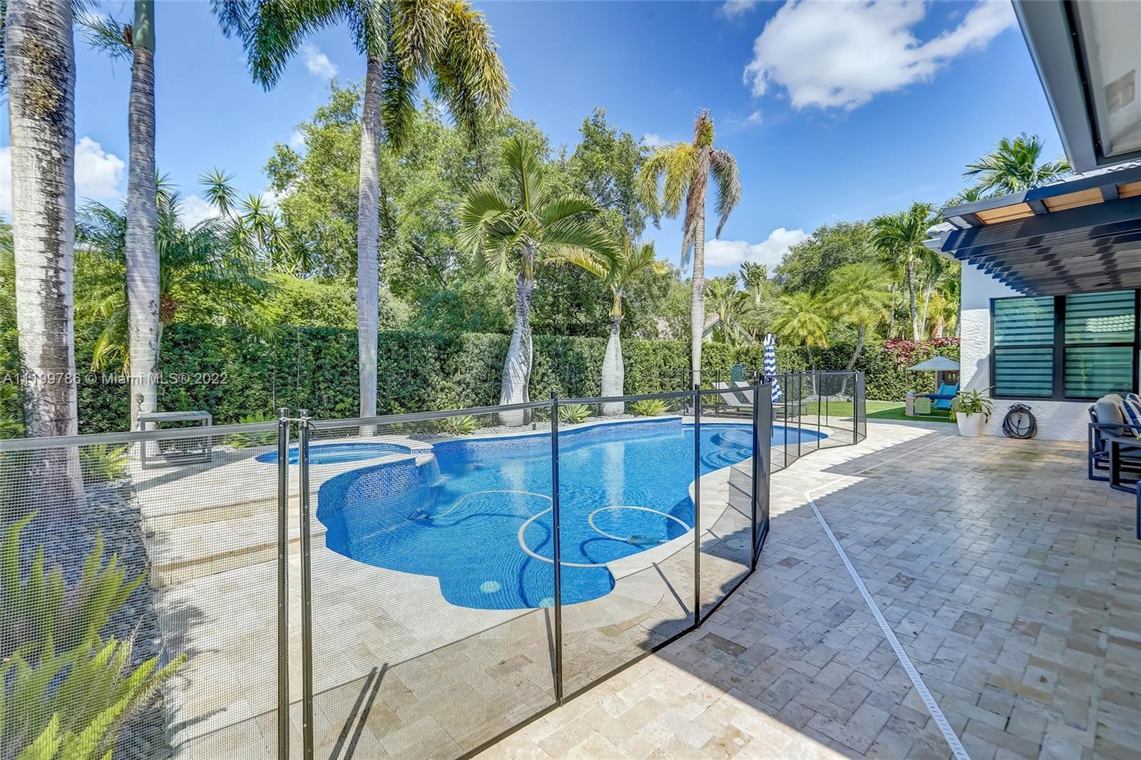 9901 North Abiaca Circle Davie, FL 33328 - Photo 23 of 46 a view of a swimming pool with a patio