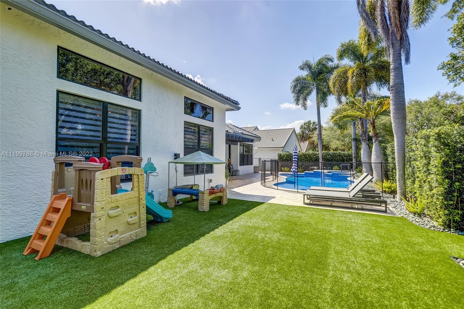 9901 North Abiaca Circle Davie, FL 33328 - Photo 25 of 46 a view of outdoor space yard deck and patio