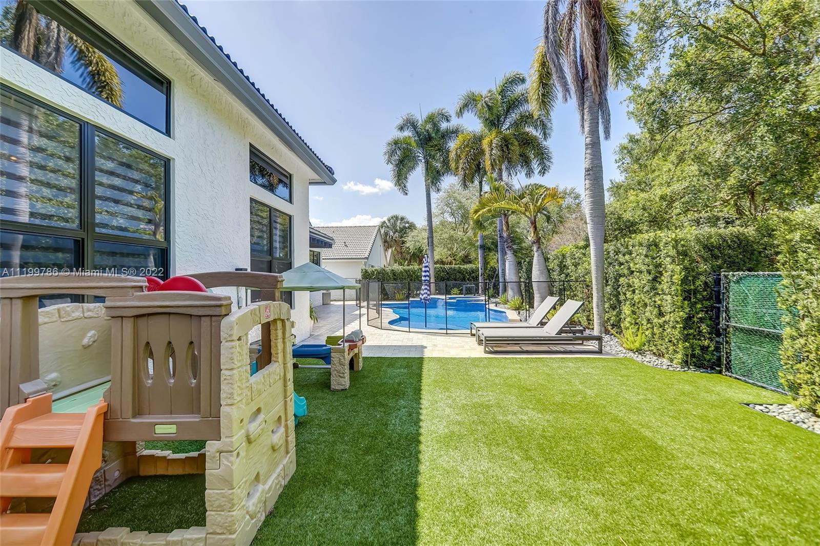 9901 North Abiaca Circle Davie, FL 33328 - Photo 26 of 46 a view of outdoor space yard deck patio and swimming pool