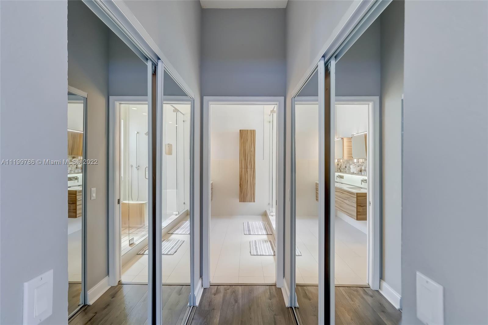 9901 North Abiaca Circle Davie, FL 33328 - Photo 30 of 46 a view of a hallway with wooden floor and staircase