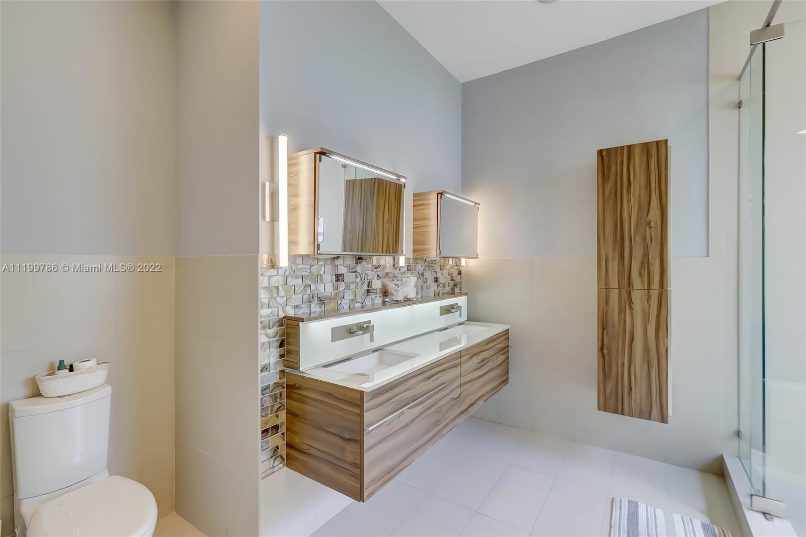 9901 North Abiaca Circle Davie, FL 33328 - Photo 32 of 46 a bathroom with a sink vanity mirror and toilet