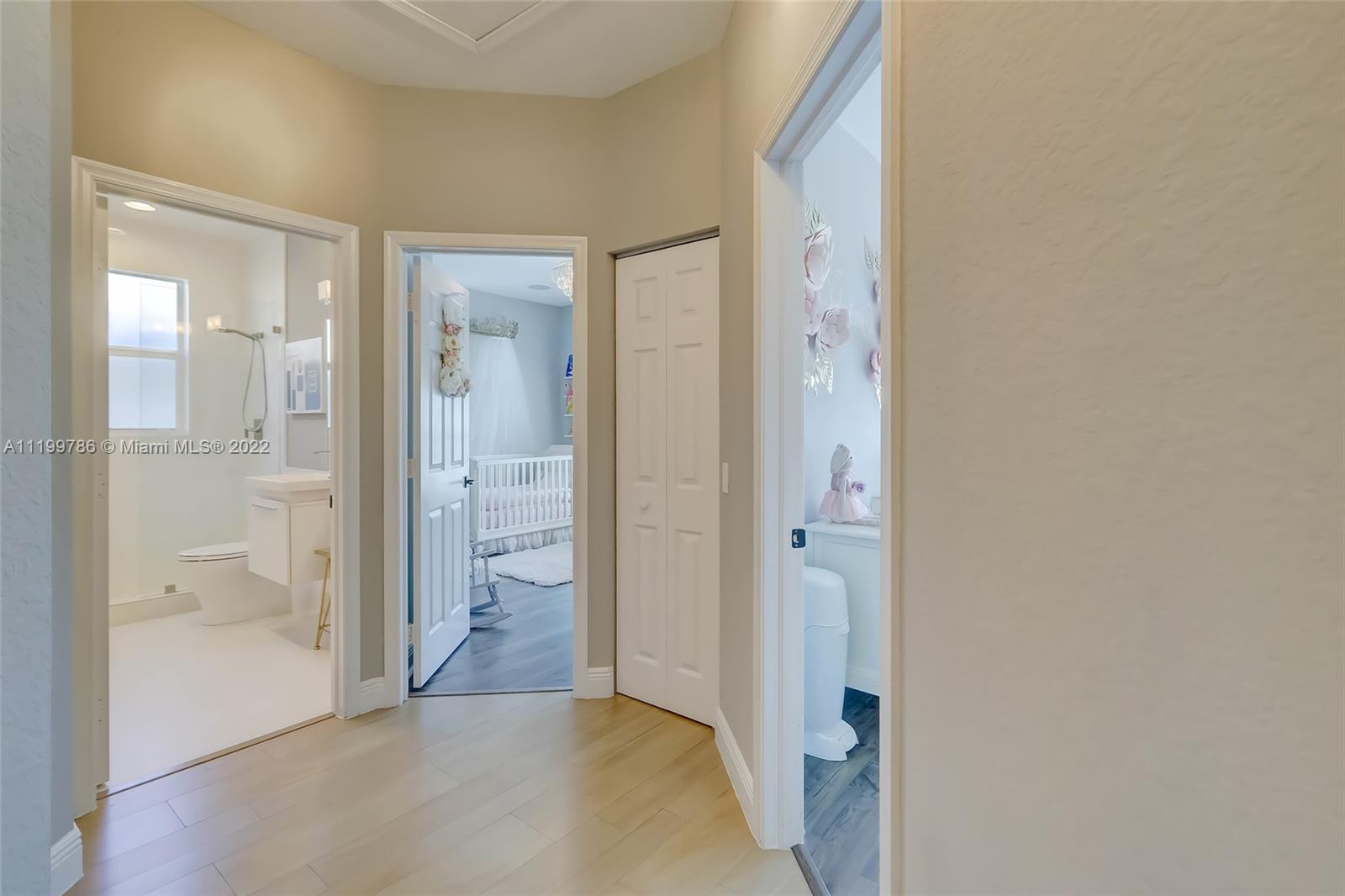 9901 North Abiaca Circle Davie, FL 33328 - Photo 38 of 46 a view of a bathroom with a glass door shower