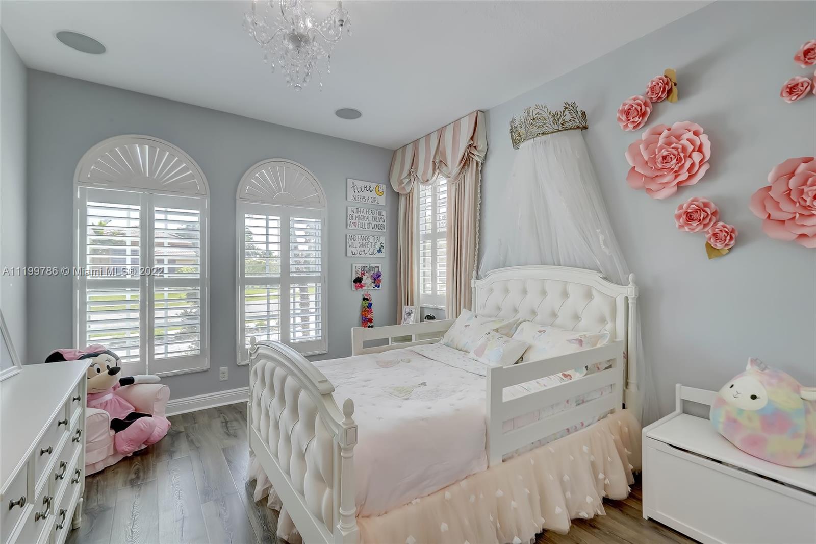 9901 North Abiaca Circle Davie, FL 33328 - Photo 39 of 46 a bedroom with a bed and a window