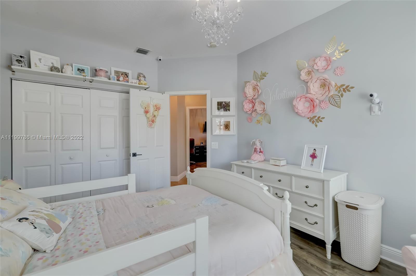 9901 North Abiaca Circle Davie, FL 33328 - Photo 40 of 46 a bedroom with a bed and a window