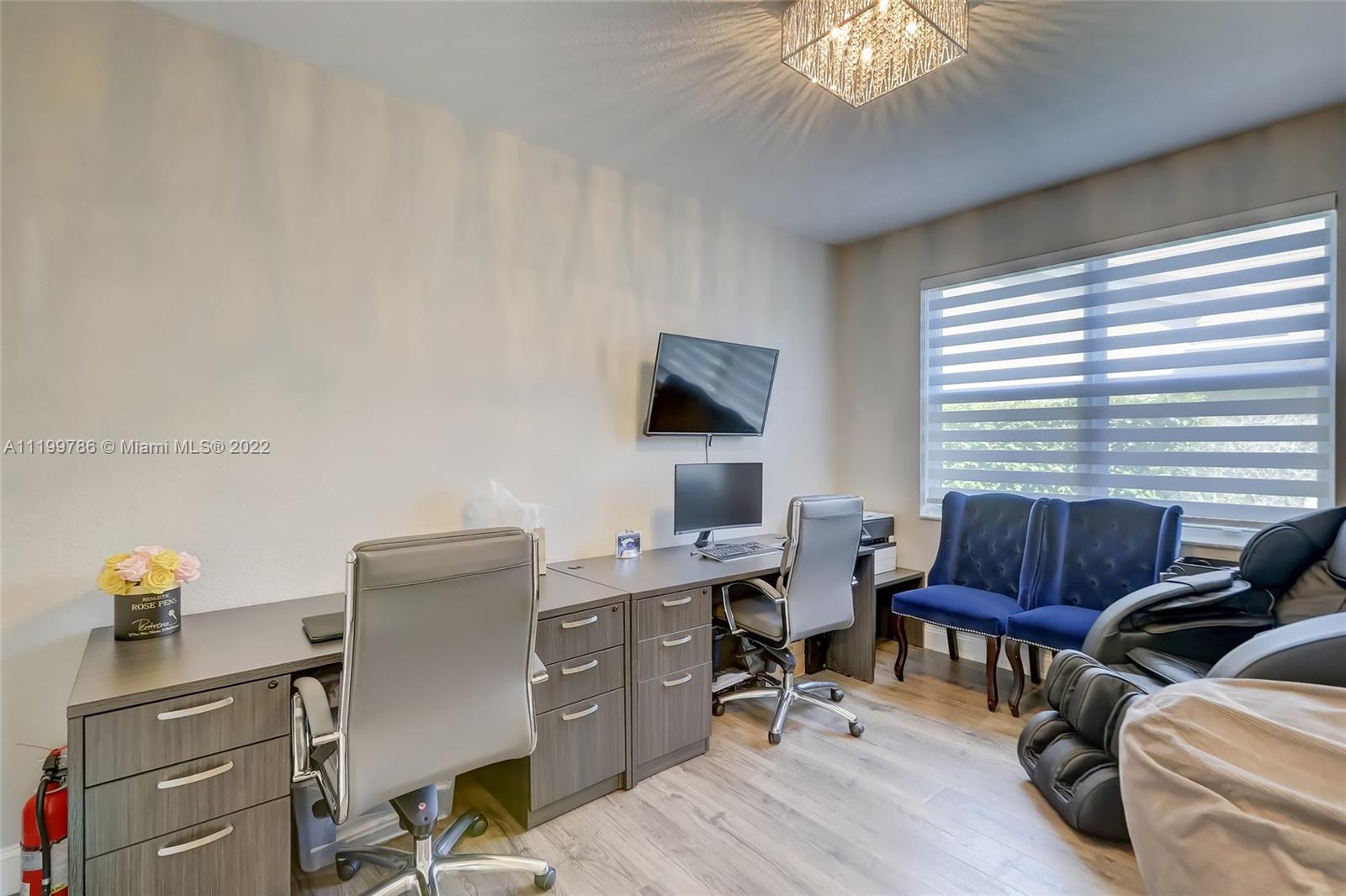 9901 North Abiaca Circle Davie, FL 33328 - Photo 44 of 46 a view of a livingroom with workspace and a window