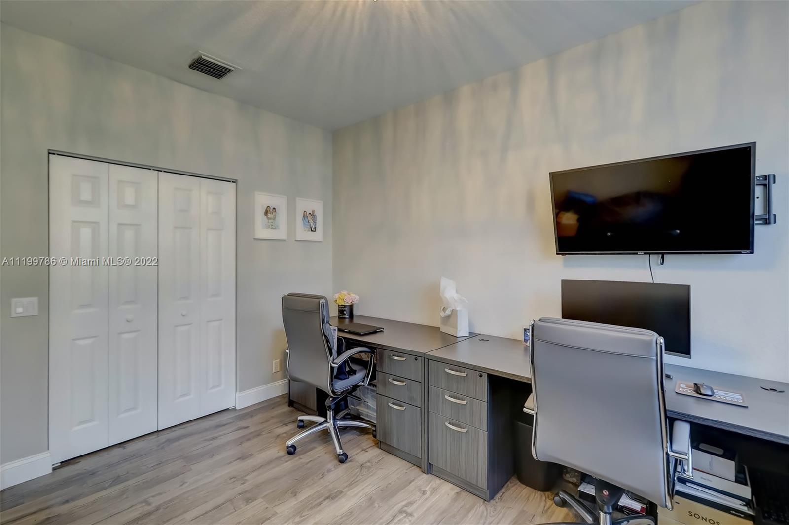 9901 North Abiaca Circle Davie, FL 33328 - Photo 45 of 46 a view of a livingroom with workspace and a window