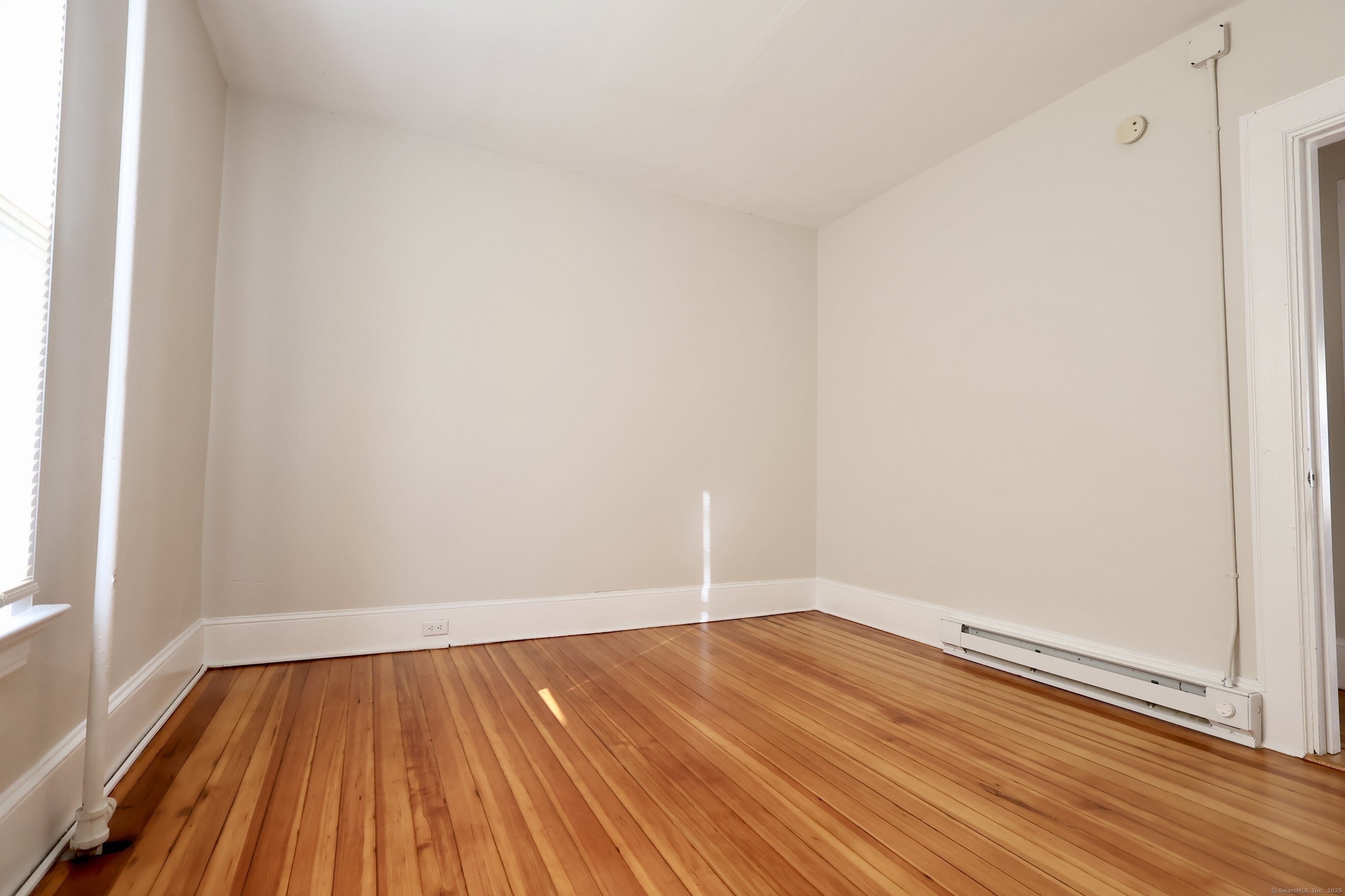 101 Stearns Street Bristol, CT 06010 - Photo 15 of 18 a view of a room with wooden floor