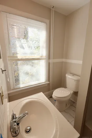 a bathroom with a sink and a toilet