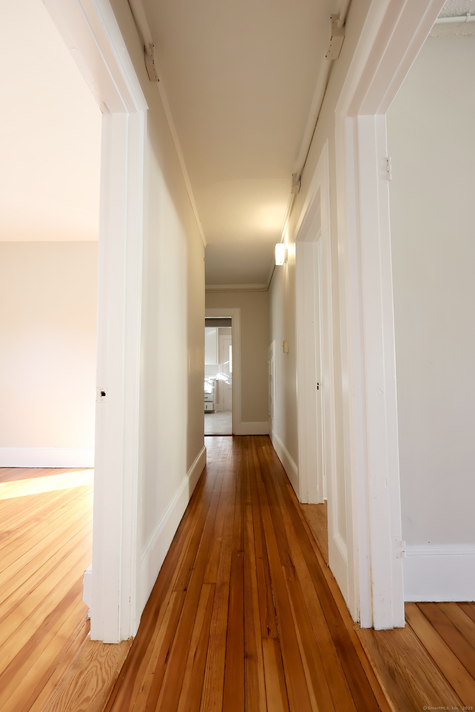 101 Stearns Street Bristol, CT 06010 - Photo 4 of 18 a view of a hallway with wooden floor