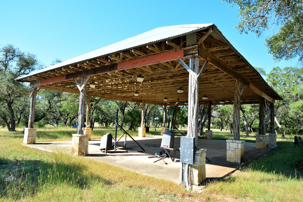 Lot 8 Private Road 1708, Unit 8 Mico, TX 78056 - Photo 24 of 32 a view of a patio with a table chairs and a backyard