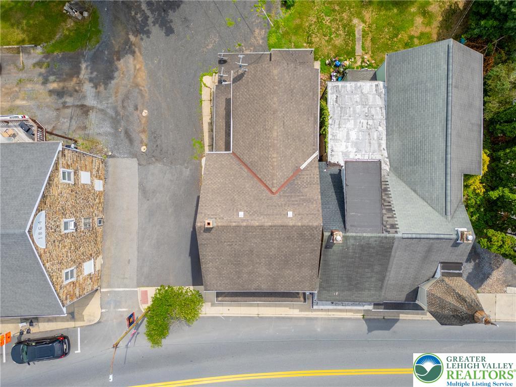 313 Main Street Slatington, PA 18080 - Photo 3 of 73 An aerial perspective reveals the property's rooflines and surrounding paved areas.
