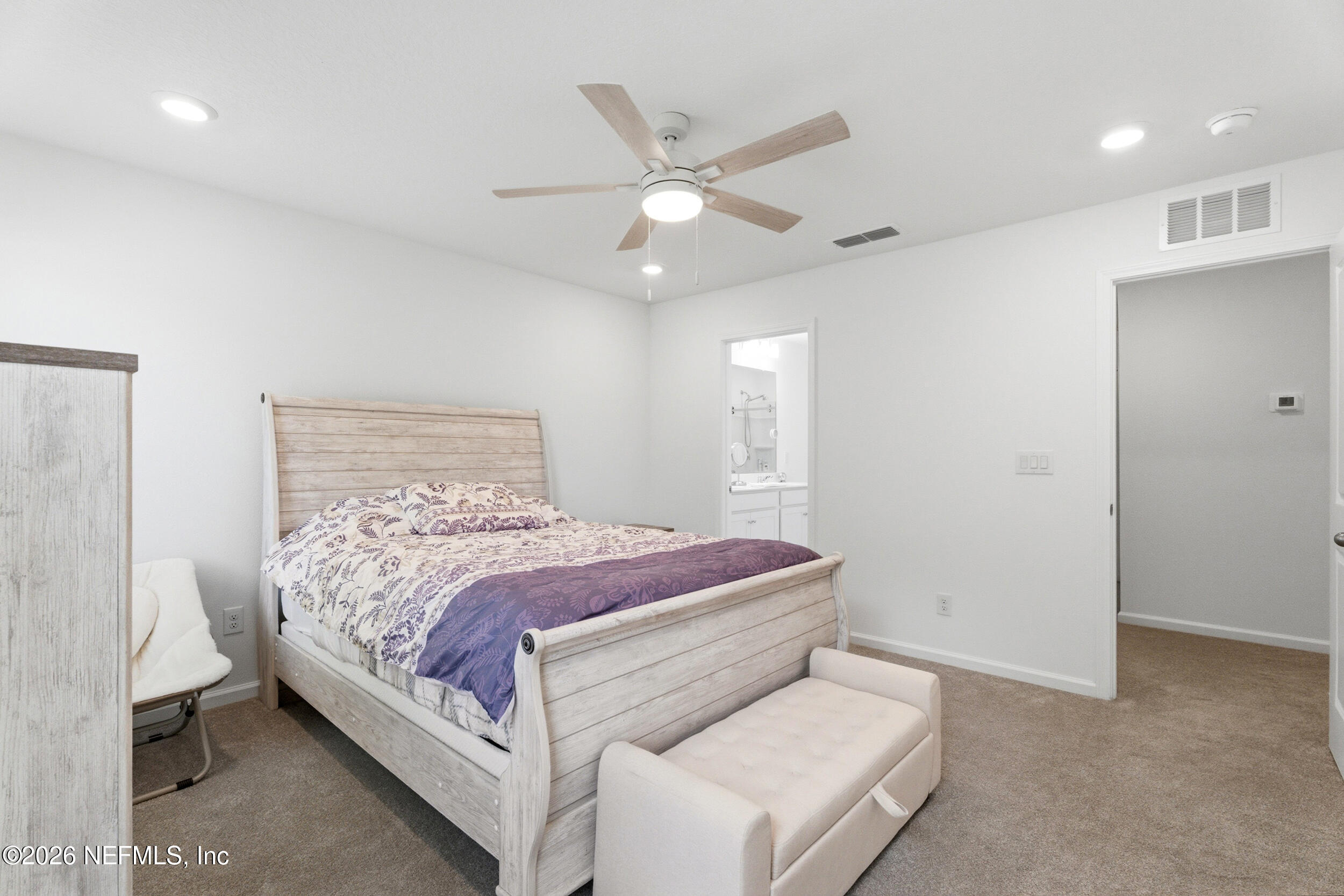 1615 Cluny Road Jacksonville, FL 32218 - Photo 10 of 18 a bed room with a bed and a ceiling fan