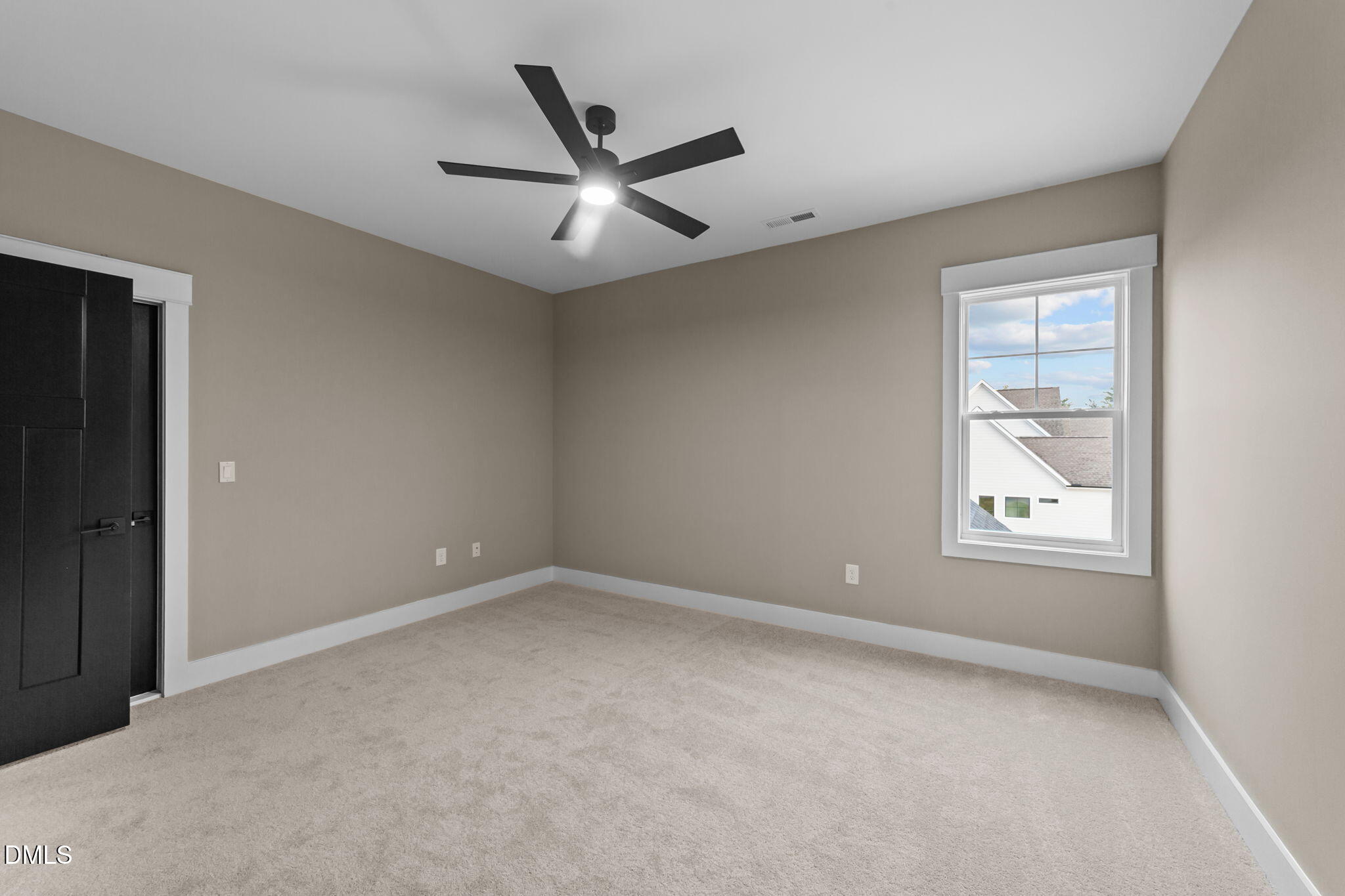 2590 Lassiter Road Four Oaks, NC 27524 - Photo 45 of 72 an empty room with a window and a fan
