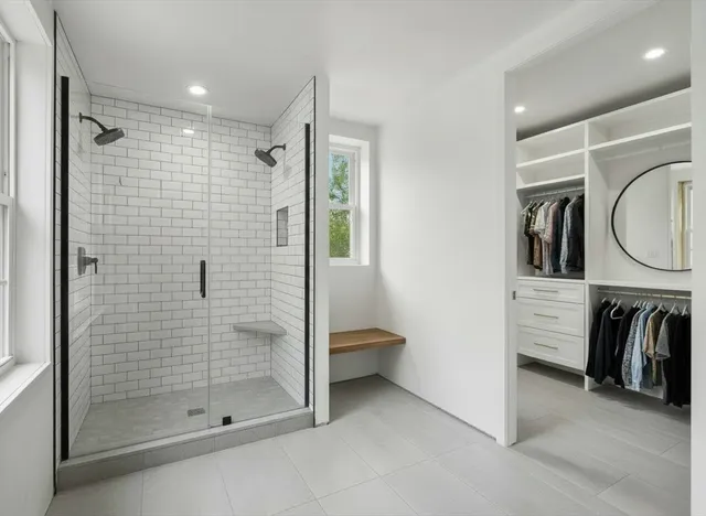 a bathroom with a shower and a sink