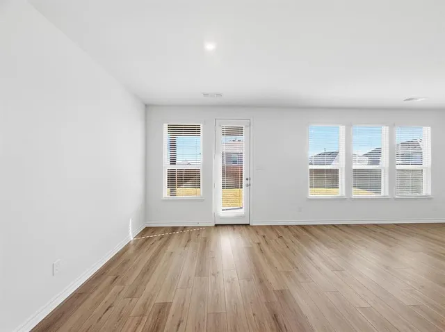 a view of kitchen with wooden floor
