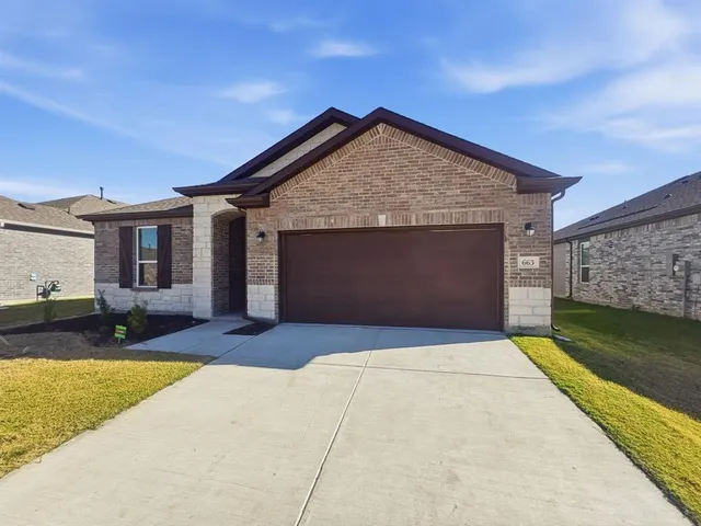 a front view of a house with yard