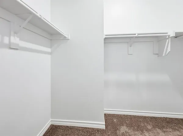 a bathroom with a sink shower and a mirror