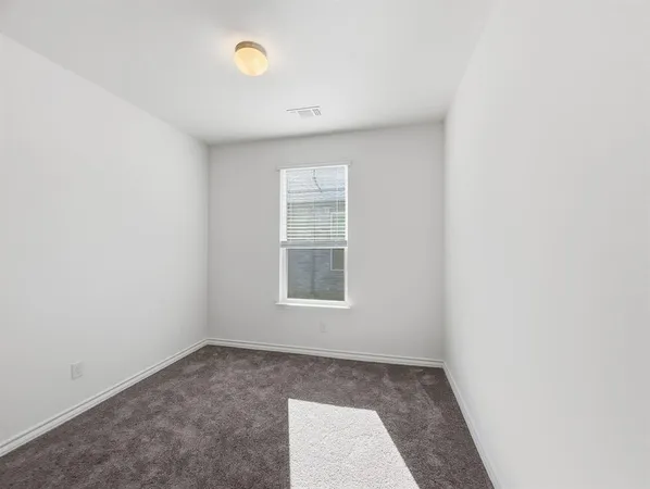 a living room with hard wood floors and a wooden floors