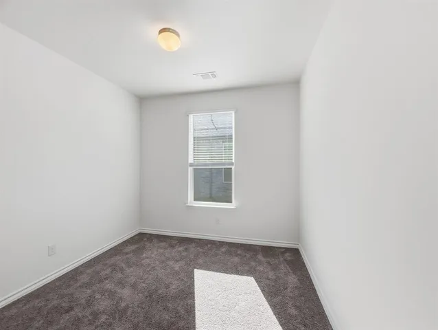 a living room with hard wood floors and a wooden floors