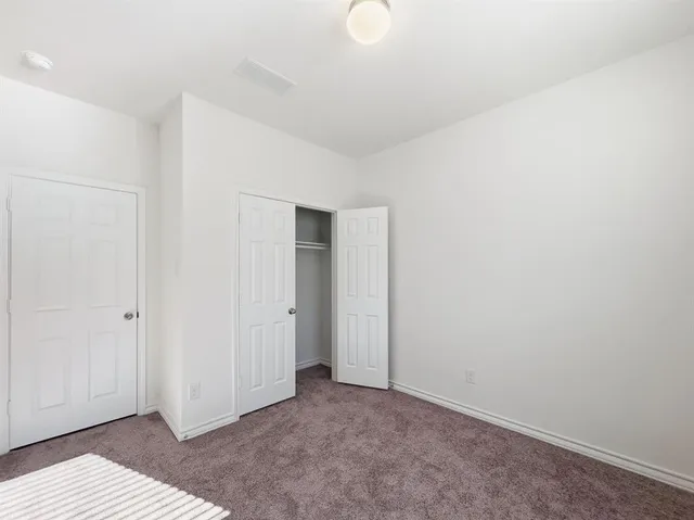 a kitchen with a sink cabinets and stainless steel appliances