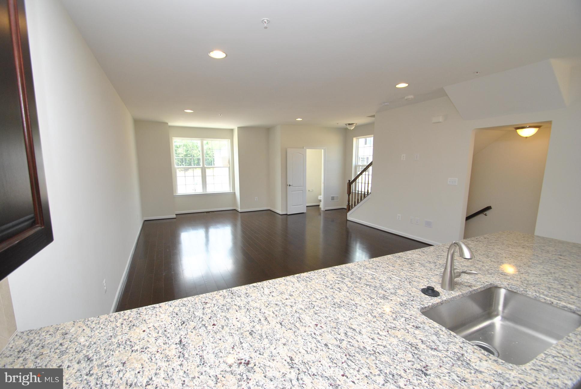944 Winter Run Road Baltimore, MD 21220 - Photo 16 of 30 a view of a kitchen with a sink and a large mirror