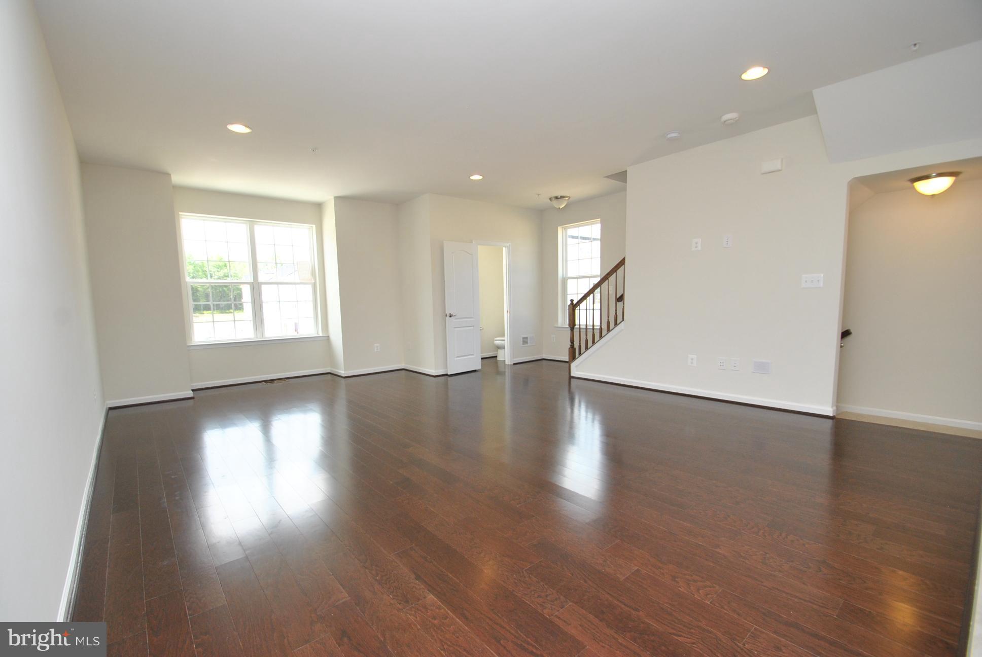 944 Winter Run Road Baltimore, MD 21220 - Photo 17 of 30 an empty room with wooden floor and windows