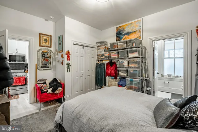 a bedroom with a bed and cabinets