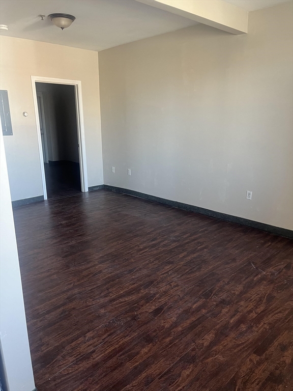 287 Hartwell Street, Unit 1 Fall River, MA 02721 - Photo 2 of 10 a view of an empty room with wooden floor and closet