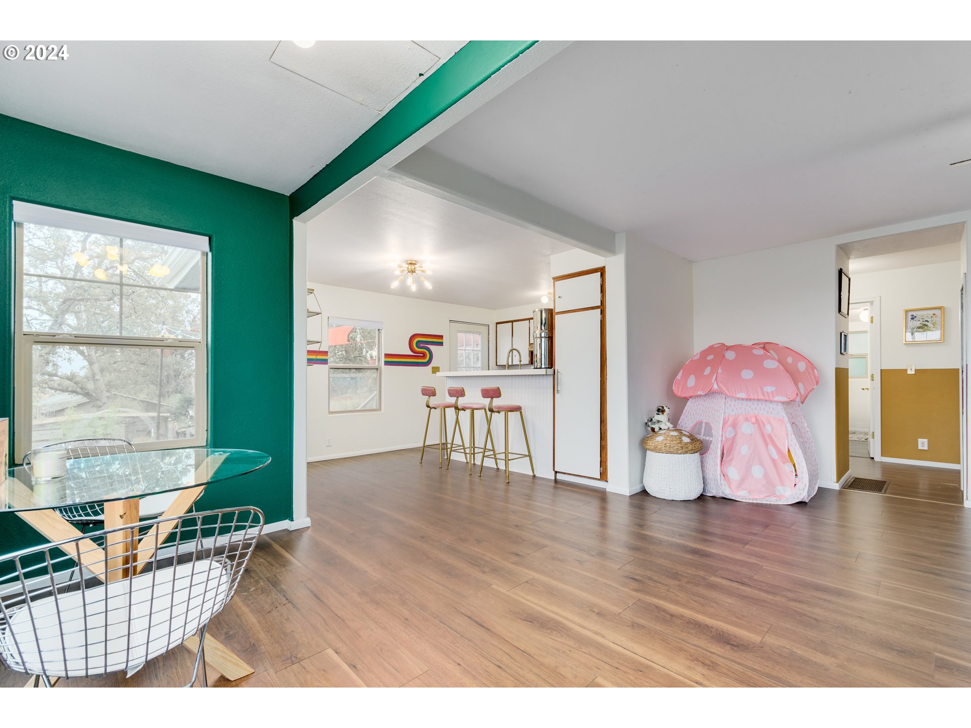 517 South 3rd Street Springfield, OR 97477 - Photo 3 of 27 a living room with furniture and a wooden floor