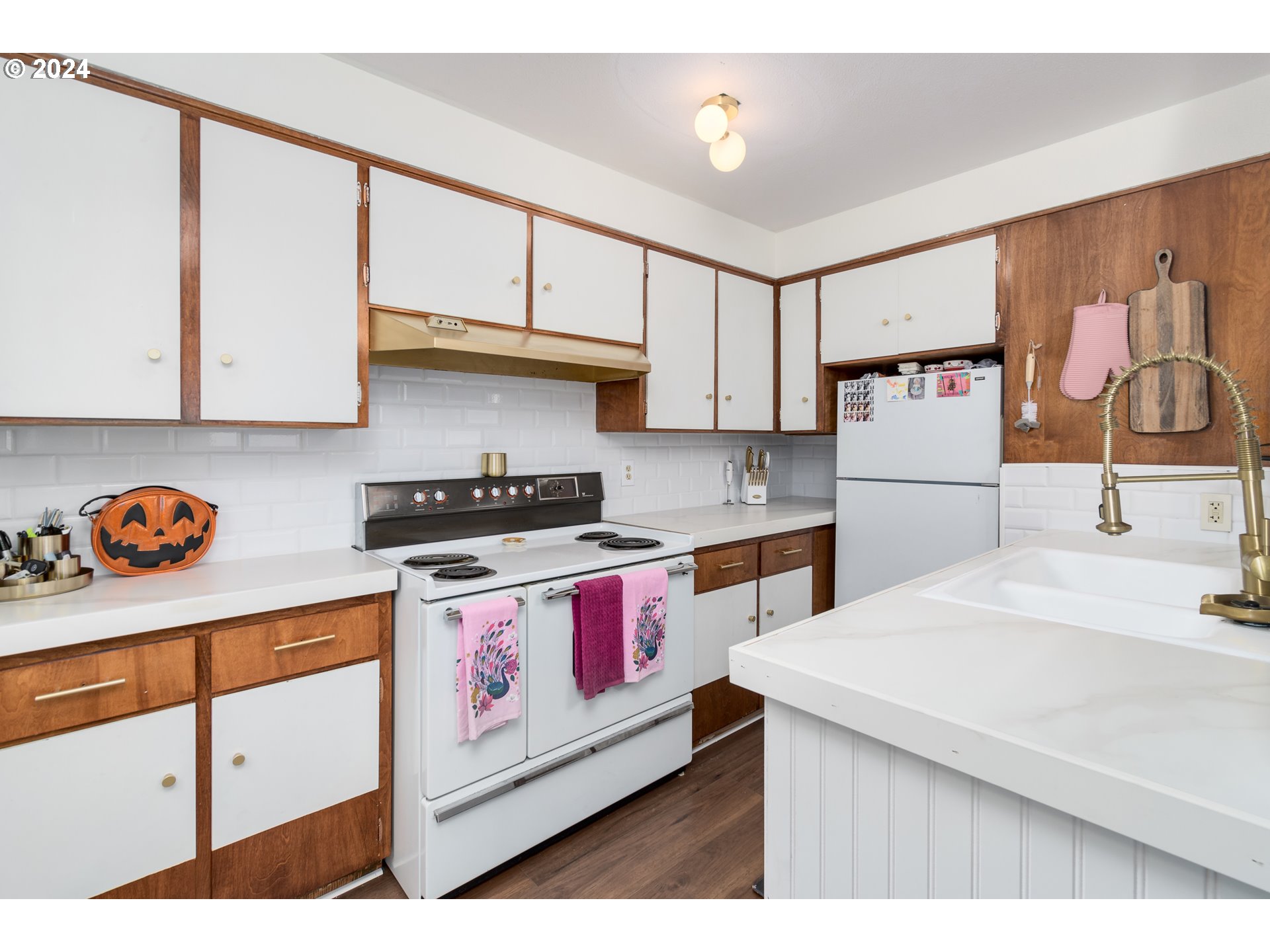 517 South 3rd Street Springfield, OR 97477 - Photo 9 of 27 a kitchen with stainless steel appliances granite countertop a stove and a white refrigerator