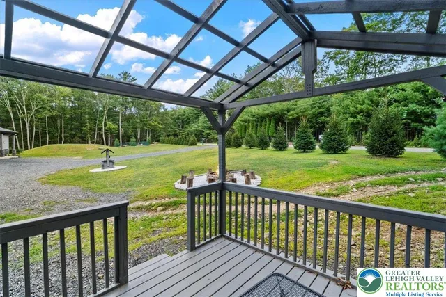 a view of a deck with a big yard