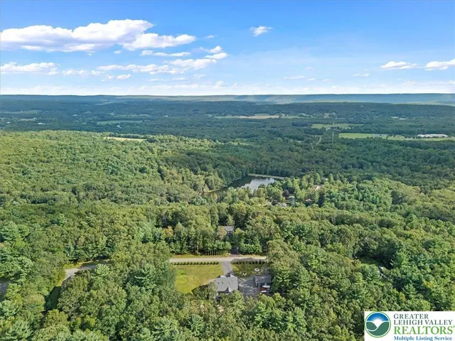 a view of a lake with a building in the background