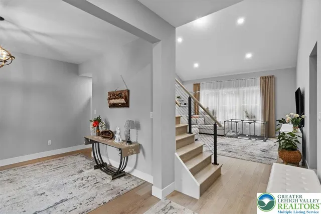 a view of entryway with window and wooden floor