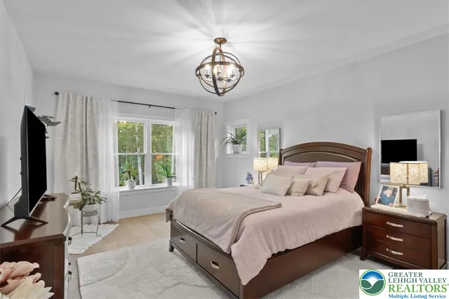 a view of entryway with wooden floor and stairs
