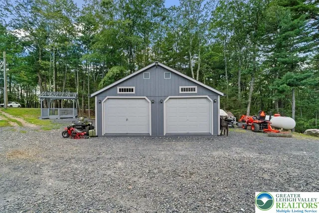a view of backyard with small garden and entertaining space