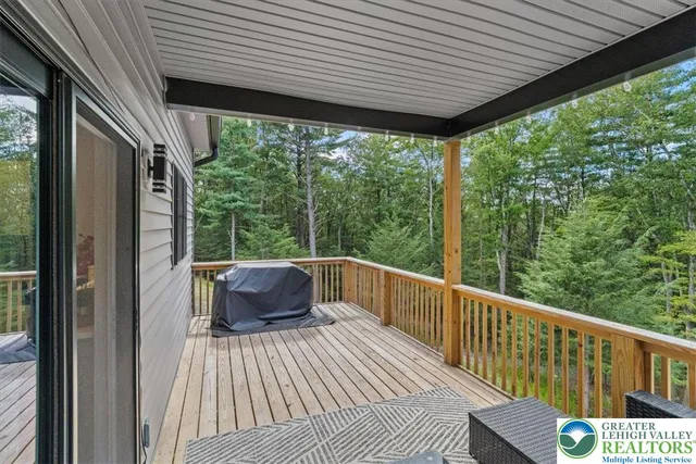a view of a two chairs in the balcony
