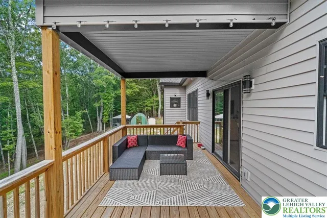 a view of balcony with wooden floor