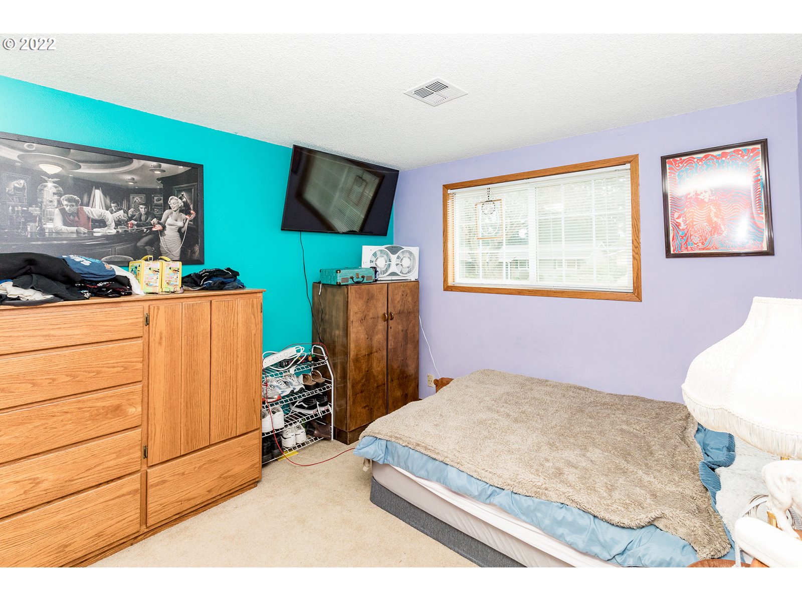 753 Rowan Avenue Springfield, OR 97477 - Photo 11 of 30 a bedroom with a bed and wooden floor