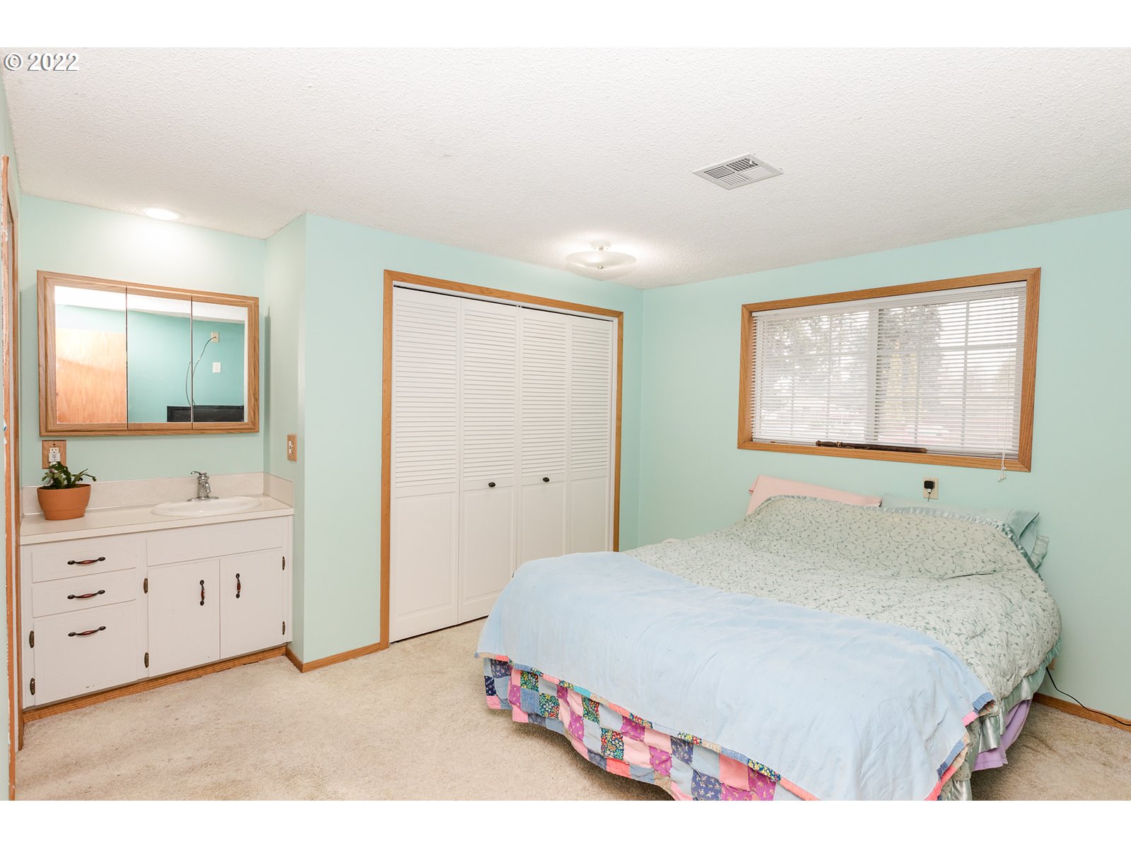 753 Rowan Avenue Springfield, OR 97477 - Photo 13 of 30 a bedroom with a bed and a dresser