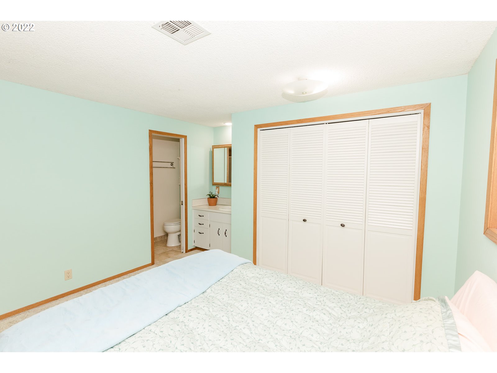 753 Rowan Avenue Springfield, OR 97477 - Photo 14 of 30 a big room with closet and wooden floor