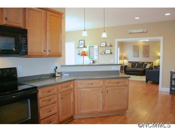 241 Hunters Trace Rutherfordton, NC 28139 - Photo 13 of 24 a kitchen with granite countertop a sink stainless steel appliances and cabinets