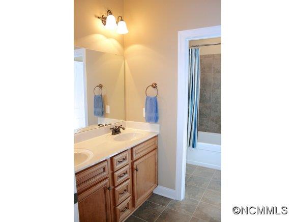 241 Hunters Trace Rutherfordton, NC 28139 - Photo 17 of 24 a bathroom with a sink and a mirror