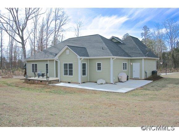 241 Hunters Trace Rutherfordton, NC 28139 - Photo 3 of 24 a view of a house with a patio and a yard