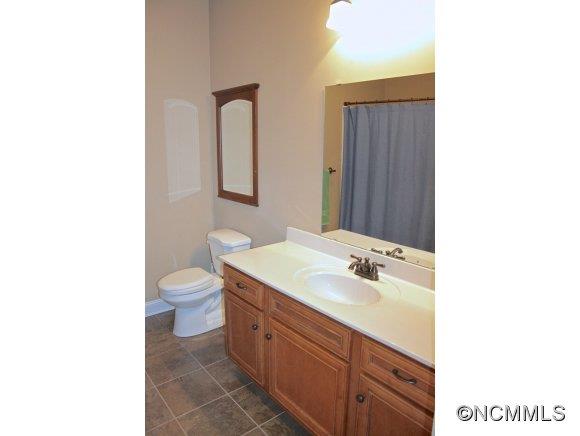 241 Hunters Trace Rutherfordton, NC 28139 - Photo 22 of 24 a bathroom with a sink toilet and mirror