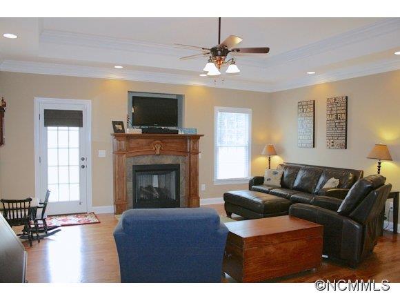 241 Hunters Trace Rutherfordton, NC 28139 - Photo 8 of 24 a living room with furniture a flat screen tv and a fireplace