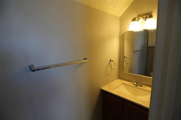 a bathroom with a sink and mirror