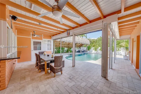a kitchen with stainless steel appliances kitchen island granite countertop a refrigerator and a stove