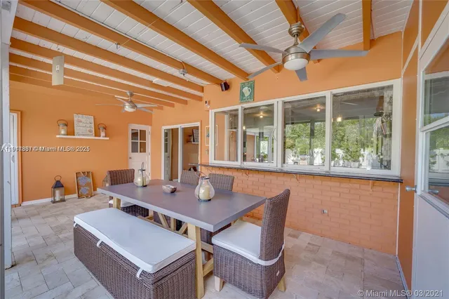 a large bed sitting in a room next to a window